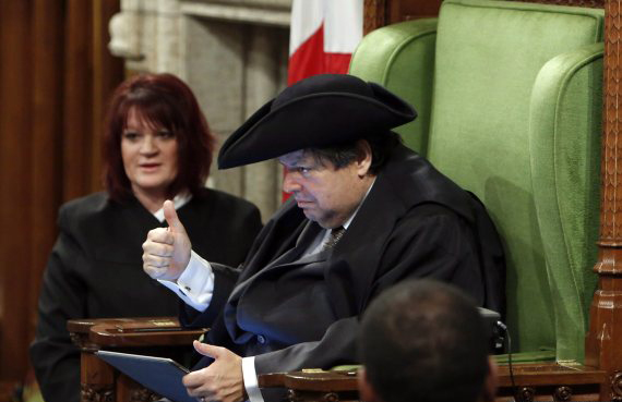 Liberal MP Mauril Belanger gives a thumbs-up as he sits in the Speaker's Chair to preside over the House of Commons Wednesday, serving as honorary Speaker, in a tribute organized by his fellow MPs following his diagnosis with ALS last November, in Ottawa Wednesday March 9, 2016. THE CANADIAN PRESS/Fred Chartrand