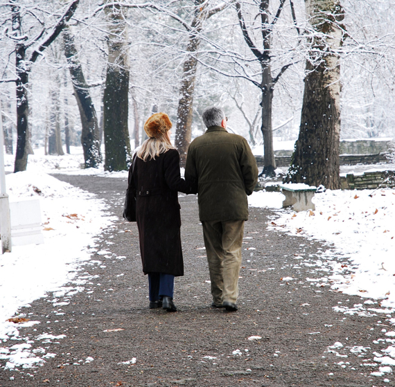Senior couple walking in park at winter. (Photo illustration by Shutterstock)