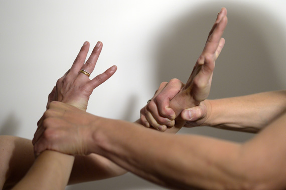 ILLUSTRATION - A staged image on domestic violence: A man (R) is forcefully holding on to the wrists of a woman inÊBerlin, Germany, 07 June 2016. Photo:ÊMaurizio Gambarini/dpa