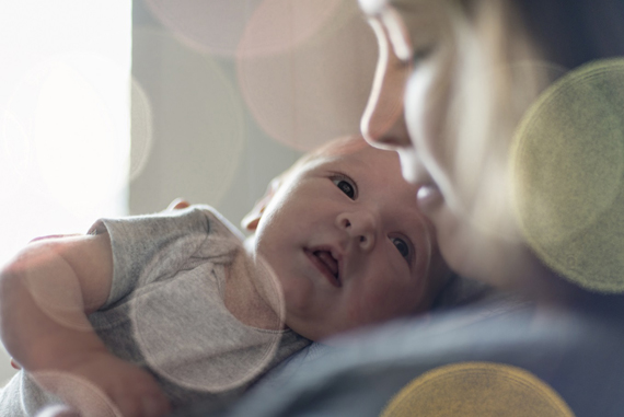 baby boy and mother looking at each other tenderly